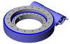 Covered slewing rings with integrated worm